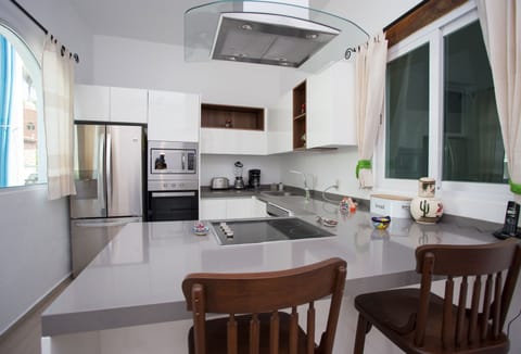 Luxury Suite, 1 Bedroom | Private kitchen | Microwave, coffee/tea maker, highchair, cookware/dishes/utensils