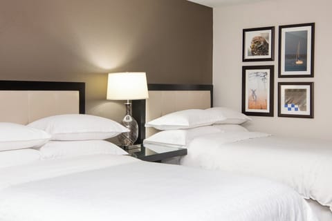 Premium bedding, down comforters, pillowtop beds, in-room safe