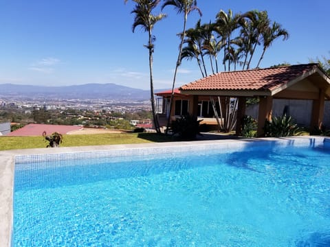 Outdoor pool, pool umbrellas, sun loungers