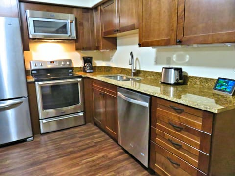 Romantic 1- Bedroom Condo with Full Kitchen | Private kitchen | Full-size fridge, microwave, oven, stovetop