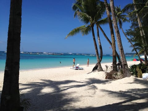 On the beach, sun loungers, beach umbrellas