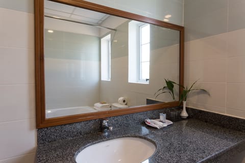 Family Suite, 1 Bedroom, Balcony, Pool View | Bathroom | Combined shower/tub, deep soaking tub, free toiletries, hair dryer