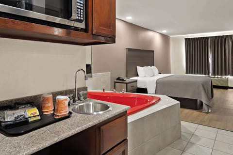 Suite, 1 King Bed, Non Smoking, Jetted Tub | Premium bedding, desk, blackout drapes, soundproofing