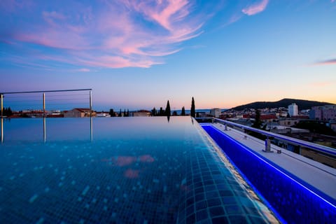 Seasonal outdoor pool, pool umbrellas, sun loungers