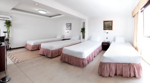 Standard Quadruple Room | In-room safe, desk, iron/ironing board, rollaway beds