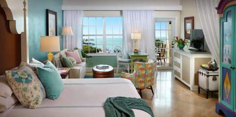 Ocean View Boutique Suite | Minibar, in-room safe, individually decorated, individually furnished