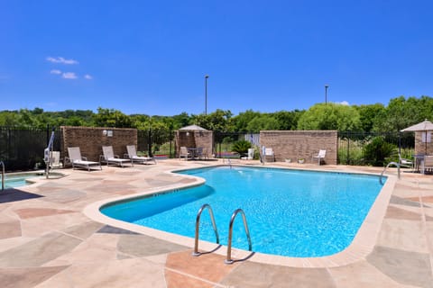 Seasonal outdoor pool, open 8:00 AM to 10:00 PM, pool umbrellas