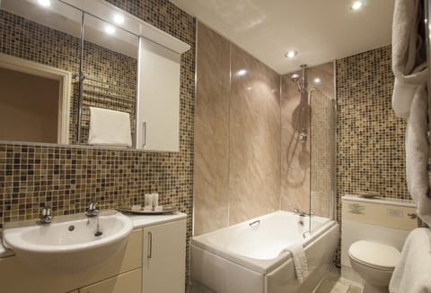 Ashton Suite, 1 King Bed | Bathroom | Eco-friendly toiletries, hair dryer, towels