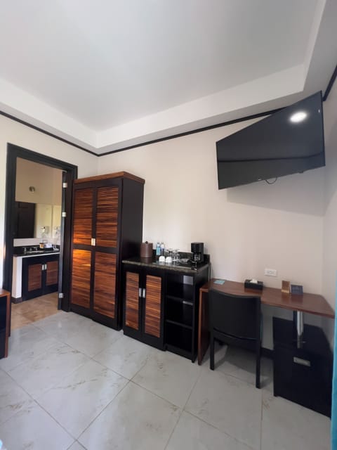 Standard Double Room | Minibar, in-room safe, desk, blackout drapes