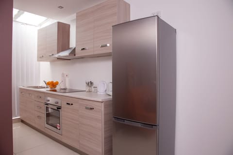 Design Apartment, 1 Bedroom (Orange) | Private kitchen | Full-size fridge, microwave, oven, stovetop