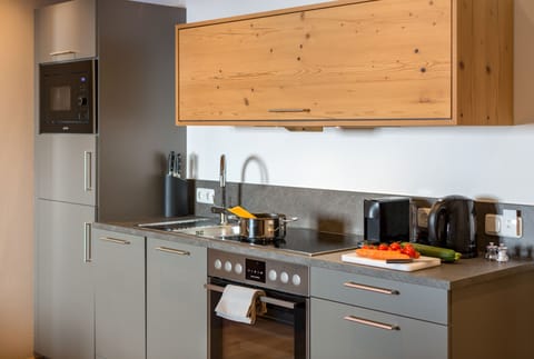 Deluxe Apartment, 2 Bedrooms (Wilderer 80 EUR cleaning fee-not incl) | Private kitchen | Fridge, highchair, cleaning supplies