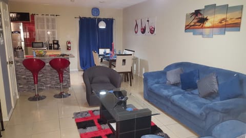 Premium Apartment, 2 Bedrooms, Mountain View | Living room | 50-inch flat-screen TV with cable channels, TV, DVD player