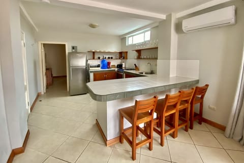 Deluxe Suite, Ensuite (One bedroom King) | Private kitchen | Fridge, microwave, stovetop, coffee/tea maker