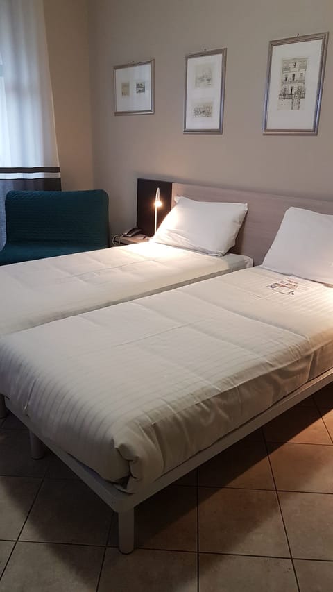 Twin Room | Down comforters, minibar, desk, blackout drapes