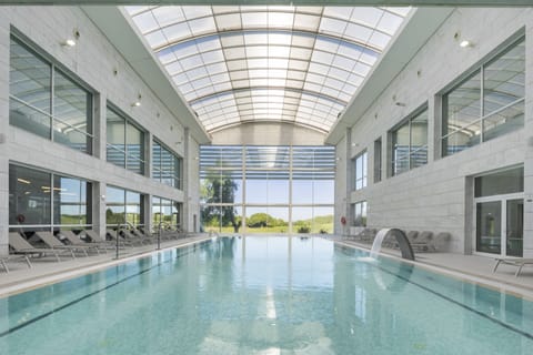 Indoor pool, outdoor pool, pool umbrellas, sun loungers