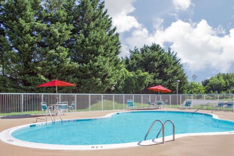 Seasonal outdoor pool, open 9:30 AM to 8:30 PM, pool umbrellas