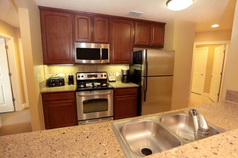 Condo, 4 Bedrooms (2 King, 1 Queen, & 2 Trundle Bed) | Private kitchen | Full-size fridge, microwave, coffee/tea maker