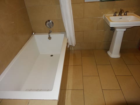 Suite, 1 King Bed with Sofa bed, Ocean View | Bathroom | Free toiletries, hair dryer, bathrobes, towels