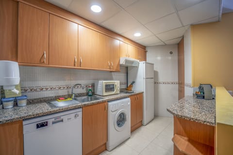 Family Apartment | Private kitchen | Full-size fridge, microwave, stovetop, coffee/tea maker