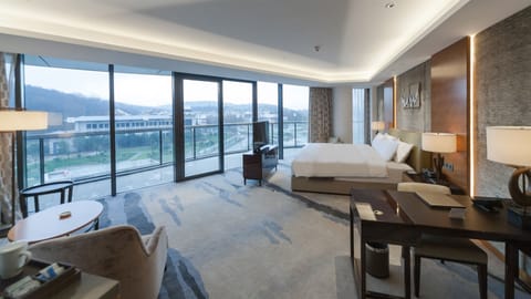 1 Bedroom Suite City View | Minibar, in-room safe, desk, blackout drapes