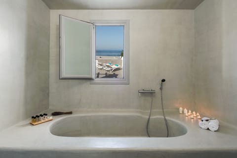 Honeymoon Studio Suite, Hot Tub (Split Level, Caldera View) | Bathroom | Shower, free toiletries, hair dryer, bathrobes