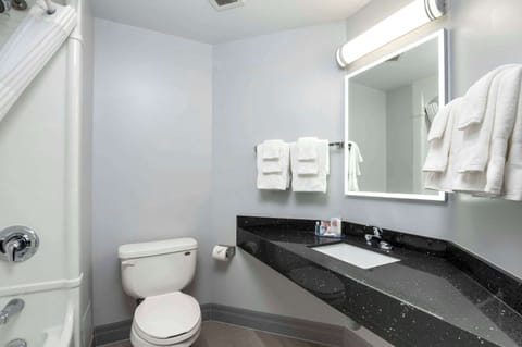 Desk, laptop workspace, blackout drapes, iron/ironing board