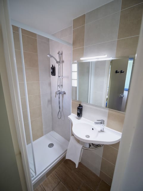 Triple Room, Multiple Beds | Bathroom | Shower, eco-friendly toiletries, hair dryer, towels