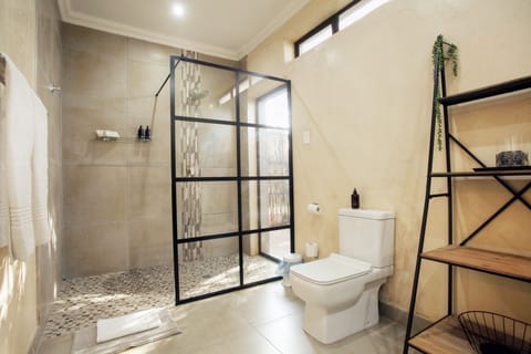 Family Room | Bathroom | Shower, rainfall showerhead, designer toiletries, hair dryer