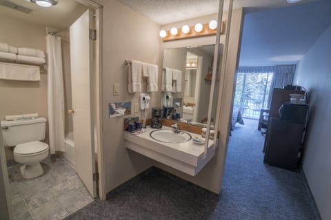 Room, 2 Queen Beds | Bathroom | Combined shower/tub, free toiletries, hair dryer, towels