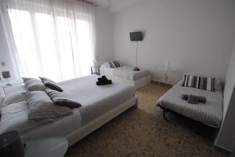 Quadruple Room, Ensuite (with balcony) | Desk, free cribs/infant beds, free WiFi, bed sheets