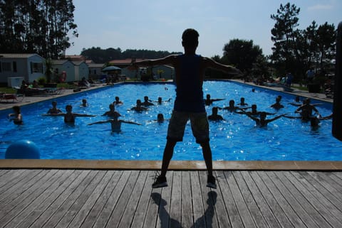 Seasonal outdoor pool, open 9:00 AM to 7:00 PM, pool umbrellas