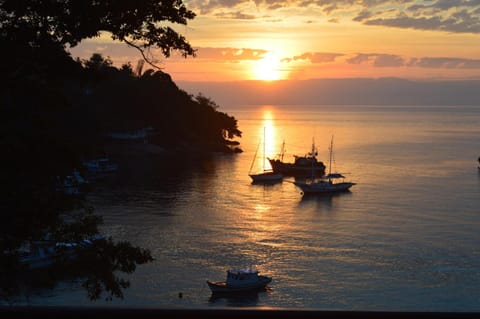 Beach nearby, white sand, beach umbrellas, beach towels