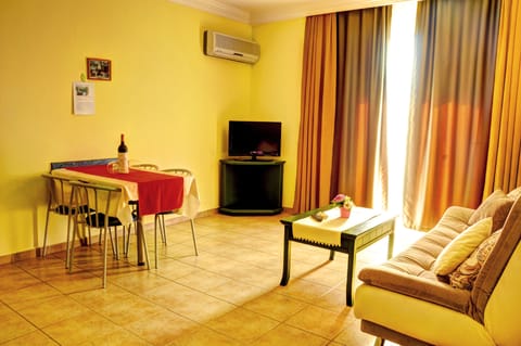 Apartment, 1 Bedroom | Living area | LCD TV