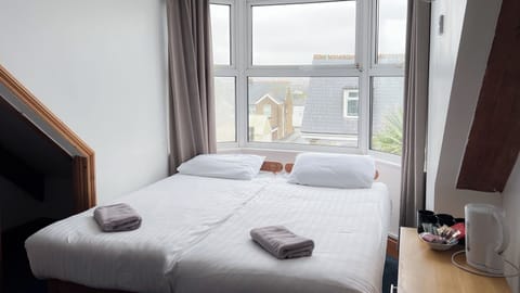 Quadruple Room (Shower) | Iron/ironing board, free WiFi, bed sheets