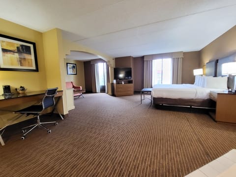 Superior Suite, 1 King Bed, Non Smoking | Desk, laptop workspace, blackout drapes, iron/ironing board