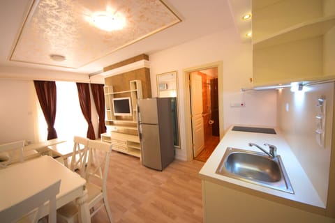 Deluxe Apartment, Sea View | Private kitchenette | Full-size fridge, stovetop, electric kettle, cookware/dishes/utensils