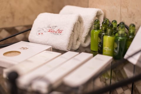 Eco-friendly toiletries, hair dryer, slippers, towels