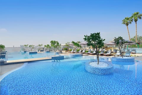 Outdoor pool, open 7:00 AM to 8:00 PM, free cabanas, pool umbrellas