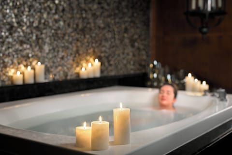 Couples treatment rooms, spa tub, body treatments, deep-tissue massages