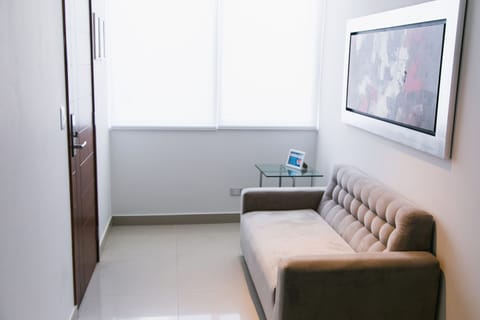 Executive Suite, Accessible, Refrigerator & Microwave | Living room | Flat-screen TV