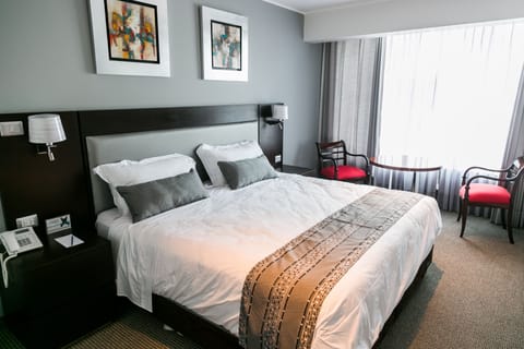 Junior Suite, 1 King Bed, Refrigerator & Microwave, Tower | In-room safe, desk, soundproofing, iron/ironing board