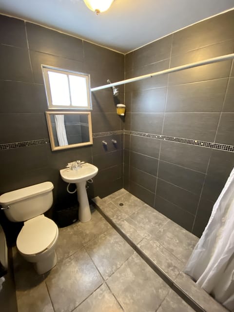 Family Room, 2 Bedrooms | Bathroom | Shower, rainfall showerhead, free toiletries, hair dryer