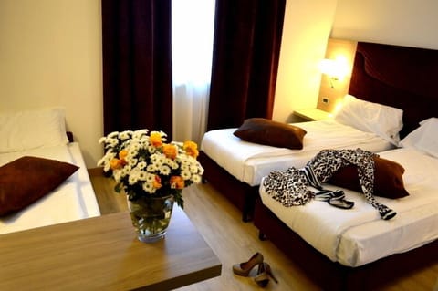 Triple Room | Minibar, in-room safe, desk, soundproofing