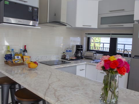 Family Villa | Private kitchen | Full-size fridge, coffee/tea maker