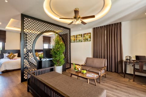 Family Suite, Balcony | Living area | 32-inch flat-screen TV with cable channels, TV