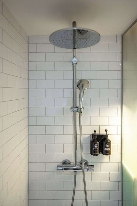 Shower, rainfall showerhead, designer toiletries, hair dryer