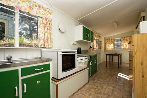 Pine Lodge (Bedding Linen Not Provided) | Private kitchen | Fridge, microwave, rice cooker, cleaning supplies