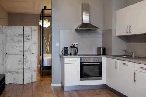 Apartment, 2 Bedrooms | Private kitchen | Fridge, microwave, stovetop, dishwasher