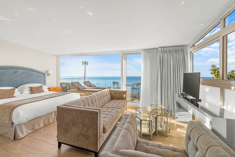 Junior Suite, 1 Bedroom, Sea View | Living area | TV, iPod dock