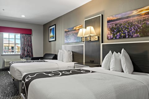 Deluxe Suite, 2 Queen Beds | Hypo-allergenic bedding, down comforters, desk, blackout drapes